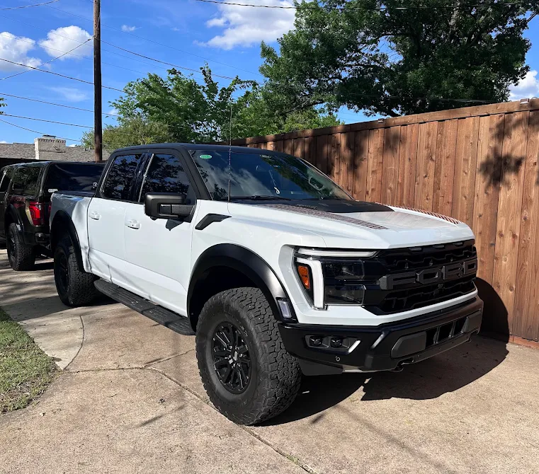 White Ford Raptor with tuxedo wrap, PPF, and ceramic coating