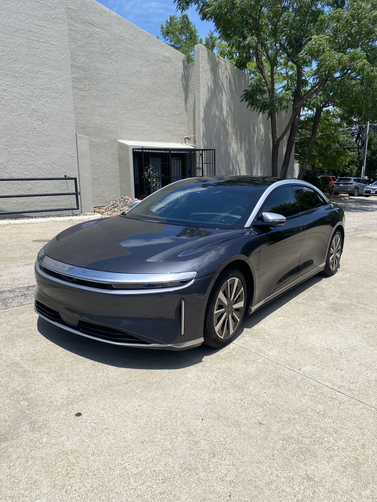 The same Lucid Air in factory grey before the film