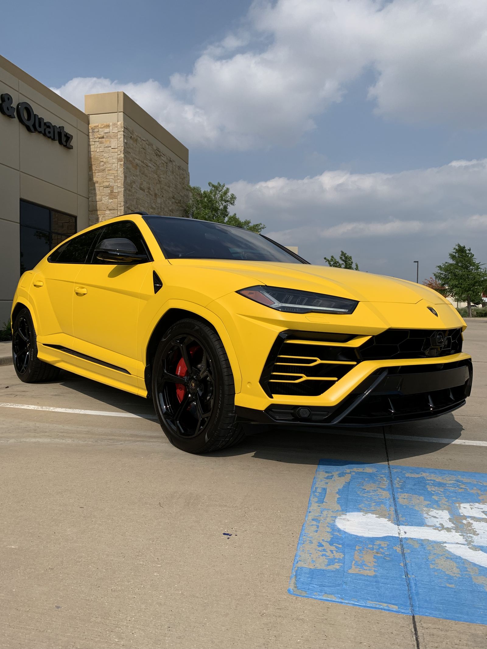 Yellow performance SUV wrapped at Wraps Redefined in Dallas