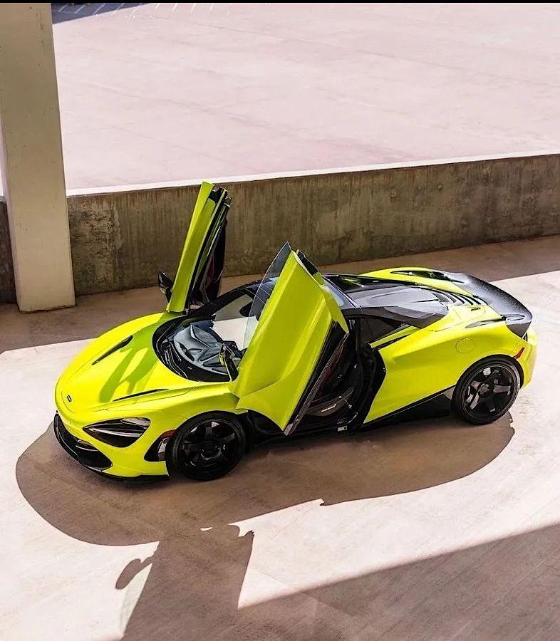 Bright green exotic supercar with doors open