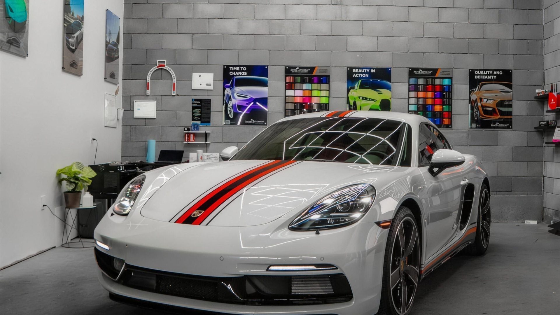 White Porsche protected with clear paint protection film in the studio