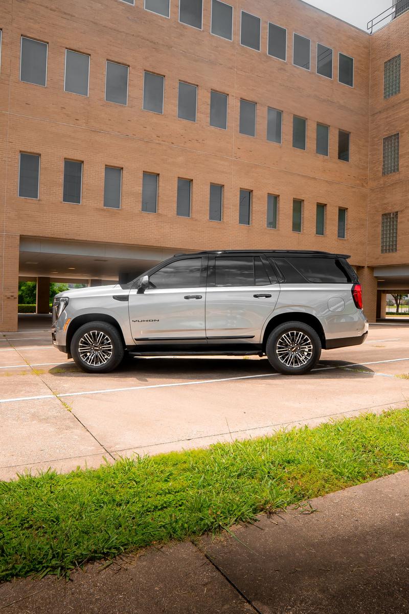 Silver luxury SUV with black tuxedo roof
