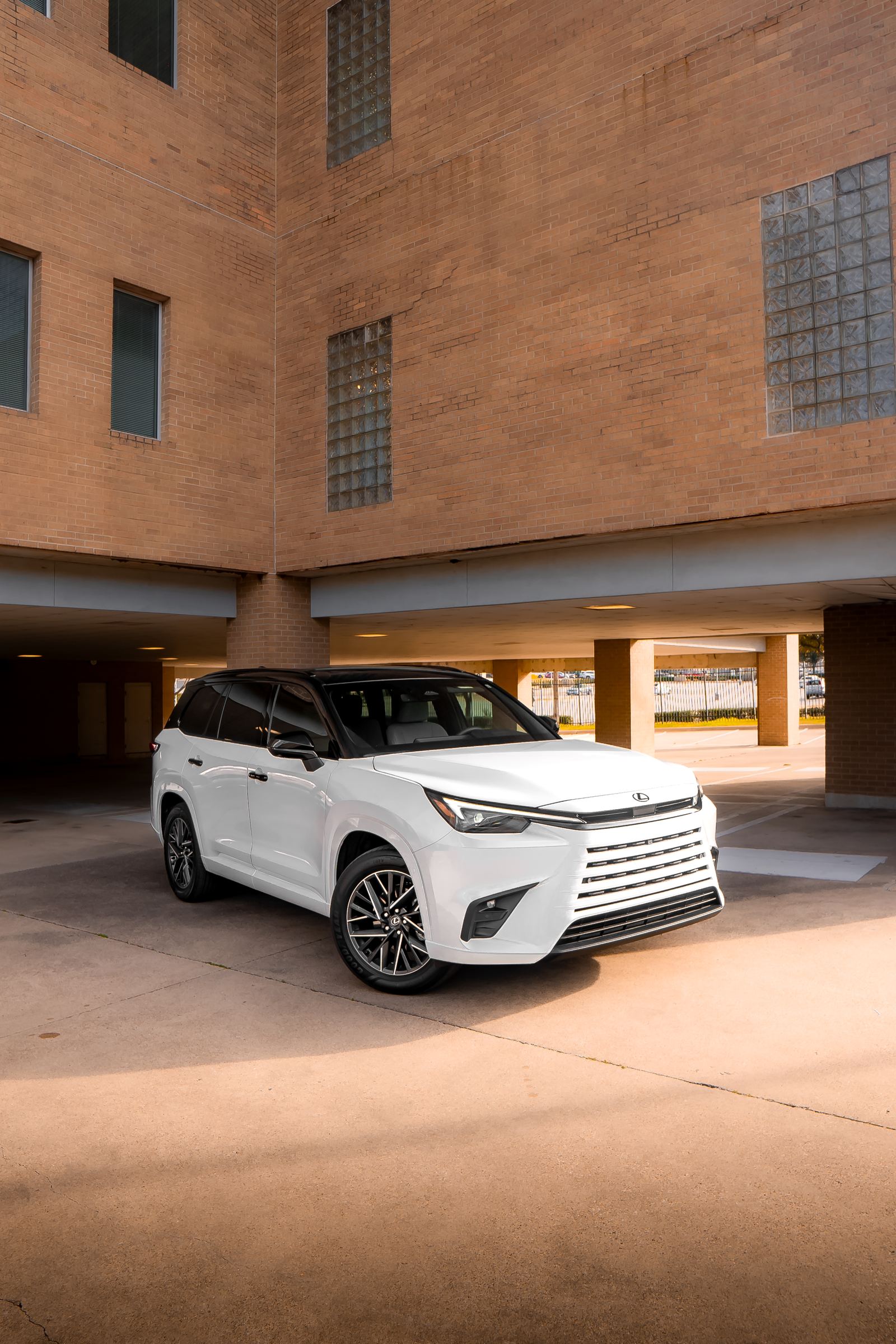White luxury SUV with black tuxedo roof wrap