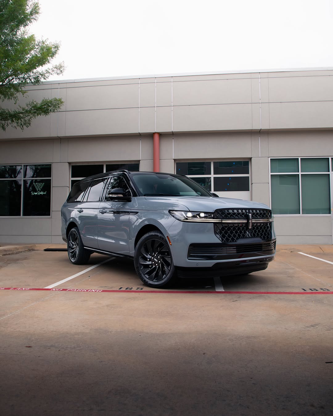 Chrome’s out. Class is in. This Navigator pulled up in factory colors and left in a full tuxedo — plus a full blackout from bumper to bum...